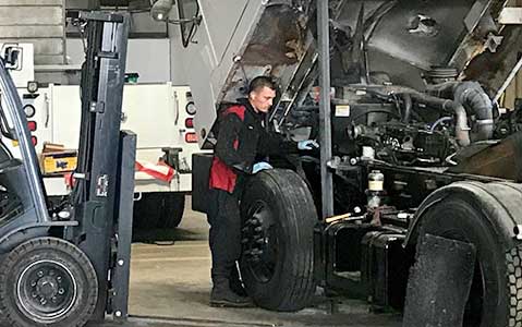 service technician working on spotter truck