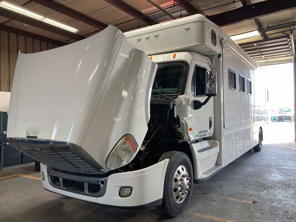 Hood open on a large diesel truck