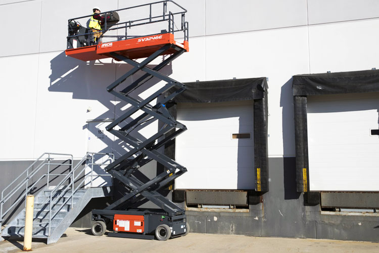 aichi scissor lift outside at warehouse dock