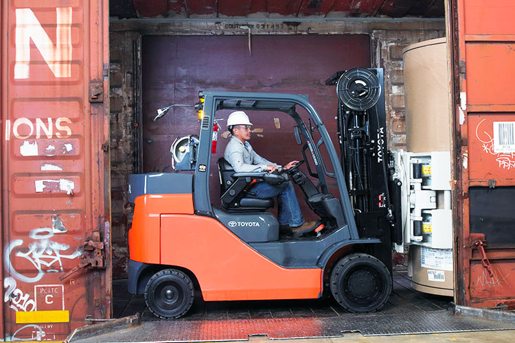 paper roll clamp attachments on a Toyota forklift